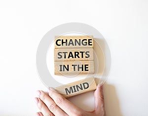 Change starts in the mind symbol. Concept words Change starts in the mind on wooden blocks. Beautiful white background.