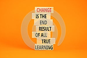 Change symbol. Concept words Change is the end result of all true learning on wooden blocks. Beautiful orange table orange
