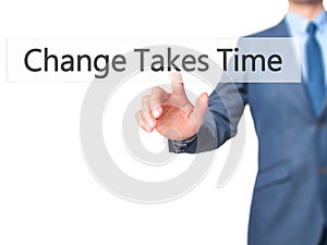 Change Takes Time - Businessman hand pressing button on touch sc