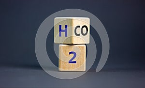 Change to fuel cell vehicles.Fliped a cube and changed the expression CO2 to H2. Beautiful grey background. Ecological concept