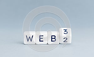 Change from web 2 to web 3 concept on Cube blocks on gray background