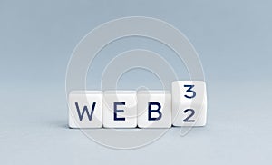 From web 2.0 to web 3.0 concept. Wooden blocks with text on gray background