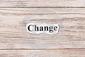 Change of the word on paper. concept. Words of Change on a wooden background