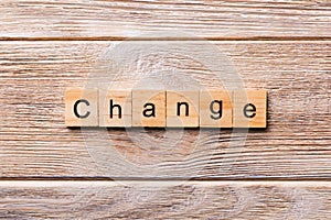 CHANGE word written on wood block. CHANGE text on wooden table for your desing, concept