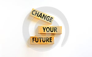 Change your future symbol. Concept words Change your future on wooden blocks on a beautiful white table white background. Business