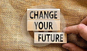 Change your future symbol. Concept words Change your future on wooden blocks on beautiful canvas table canvas background.