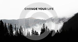 Change your life is shown using the text under the silhouette of mountains