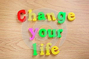 Change your life words on a table