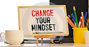 Change Your Mindset Text written on notebook page, red pencil on the right. Motivational Concept image