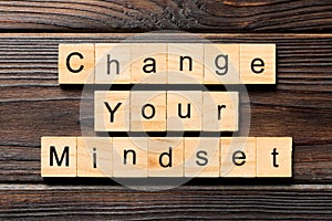 Change your mindset word written on wood block. Change your mindset text on wooden table for your desing, Top view concept