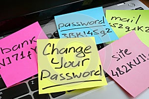Change your password. Laptop with pieces of paper