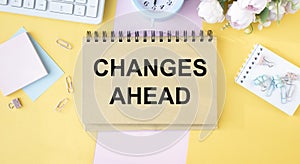 CHANGES AHEAD notepad writing on the white