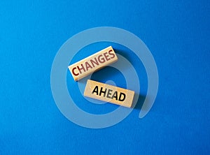 Changes ahead symbol. Wooden blocks with words Changes ahead. Beautiful blue background. Business and Changes ahead concept. Copy