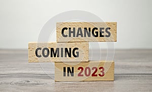 Changes coming in 2023 symbol. Concept word Changes coming in 2023 on wooden blocks