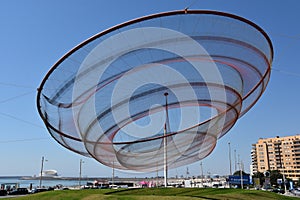 She Changes sculpture by Janet Echelman at a roundabout in Porto, Portugal