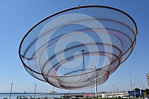 She Changes sculpture by Janet Echelman at a roundabout in Porto, Portugal