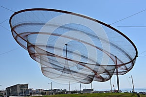 She Changes sculpture by Janet Echelman at a roundabout in Porto, Portugal