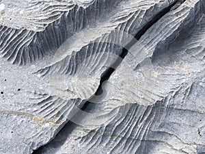 Changes, sharpness, formations, crevices, corrugated and sharp structures in stones