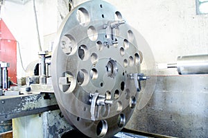 Changing arbor size on saw blade. Milling metalworking process. Industrial CNC metal machining by vertical mill.