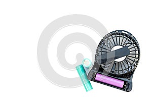 Changing battery of a small portable fan that runs on battery power isolated on a white background