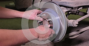 Changing brake rotor disc on a car