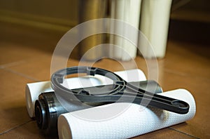 Changing filters in your home water purification system.