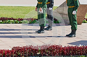 Changing of the guard of honor of the eternal flame on the day of victory in World War II. Three warriors are minting a