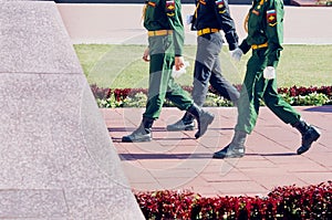 Changing of the guard of honor of the eternal flame on the day of victory in World War II. Three warriors are minting a