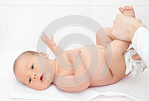 Changing nappies for an adorable little newborn photo