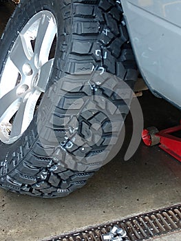 Changing new mud tires on a pick up truck