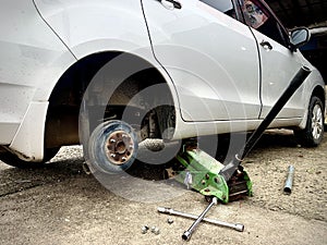 Changing tire at auto repair shop garage