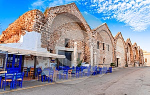 Chania Arsenals, Crete, Greece: Traditional tavern on the street of the old Venetian shipyards, old harbour of Chania in