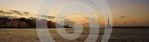 Chania, Crete, October 01 2018 Panoramic view at sunset of the entrance to the Venetian harbor