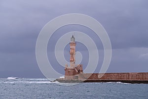 Chania\'s lighthouse resisting the rough sea in fall