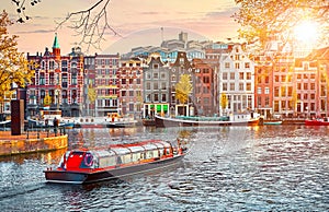 Channel in Amsterdam Netherlands houses river Amstel photo