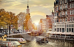 Channel in Amsterdam Netherlands houses river Amstel landmark old european city spring landscape. photo