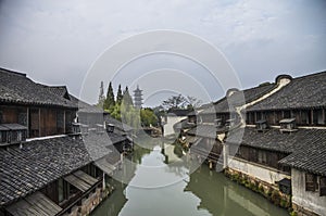 Channel with buildings on water. Zhouzhuang, China