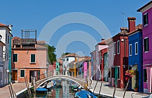 Channel with houses in Burano, Italy