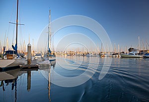 Channel Islands harbor reflections at afternoon sunset in Port Hueneme California USA