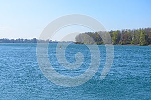 Channel marker or navigation buoy in a river