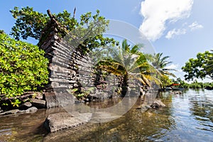 A channel and town walls in Nan Madol - prehistoric ruined stone city. Pohnpei, Micronesia, Oceania.