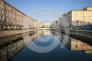 Channel Trieste with reflection over the ancient buildings. Adriatic Sea. Italy