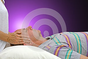 Channeling Reiki Energy to male patient photo