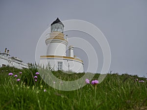 Chanonry lighthouse at the coastline in Scotland