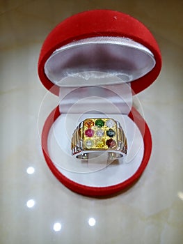 Chanthaburi, Thailand - 25 August 2020: Noppakao gemstone ring, 9 colors, size 62