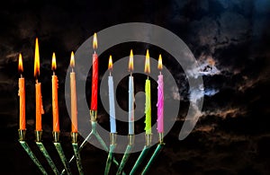 Chanukah Jewish holiday background with full moon in the evening Judaism Hanukah menorah candelabra burning candles