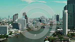 Chao Phraya River with Taksin bridge and building of Bangkok city, Thailand