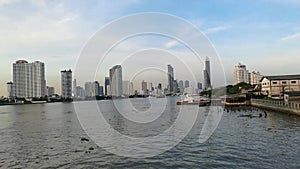 Chao phraya river view in the evening , travel by passenger ship the waterways of Bangkok Thailand