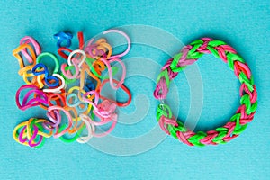 Chaos and order. Rubber bands for weaving loose and bracelet of rubber bands photo