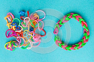 Chaos and order. Rubber bands for weaving loose and bracelet of rubber bands